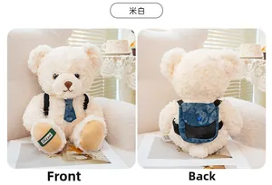Front and back detail of a cream curly plush teddy bear with blue tie and mini backpack