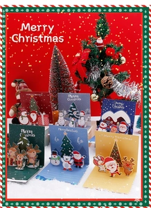 Detail of 3D pop-up Christmas cards featuring reindeer and Santa with interior message space