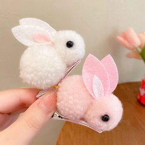 Cute 3D plush rabbit hair clips for girls in pink and white colors with metal duckbill base