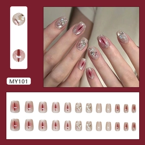 Star glitter cat-eye press-on nails with burgundy accents and crystal rhinestone accents