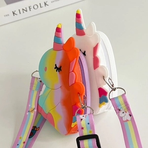 Close-up of rainbow and white unicorn silicone bags with adjustable colorful cartoon straps