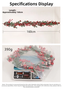 Detail view of 160cm Christmas garland with red berries, pine needles and weight at 390g