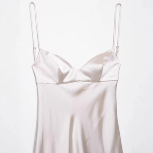 Elegant champagne satin slip dress with lace trim and delicate spaghetti straps