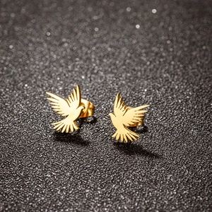 Vintage style gold stainless steel flying bird stud earrings with a polished finish