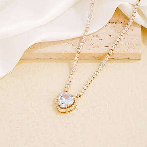 Luxury heart tennis necklace with gold-plated zircon pendant on elegant white satin