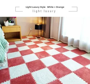 Detail of plush orange and white checkered foam floor mat showing interlocking edges