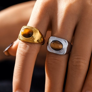 18k gold and silver geometric tiger eye rings featuring unique fingerprint textures