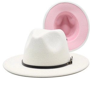 Detail of two-tone wool fedora hat in white and pink with black leather decorative belt