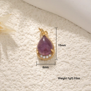 18K gold plated teardrop amethyst pendant with zircon accents on a textured background