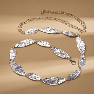 Detail of silver leaf waist chain with hammered texture and adjustable lobster clasp