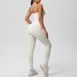 Detail of ivory yoga set featuring high waist leggings and racerback sports bra