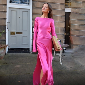 Elegant hot pink satin long sleeve maxi dress with side slit and backless detail