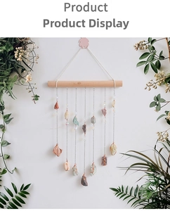 Detail of natural raw crystal stones hanging from a wooden bar in a boho wind chime decor