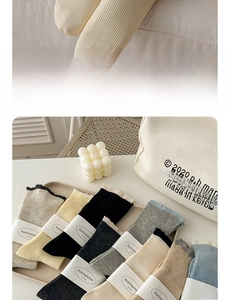 Detailed close-up of ribbed cotton lace socks in various pastel colors and knitted texture