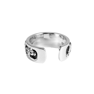 Vintage Thai silver open ring with intricate cloud and floral carvings on white backdrop
