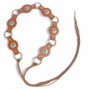 Detail of bohemian brown leather belt with turquoise flower studs and long tassels