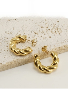 Detail of 18K gold vacuum plated twisted hoop earrings with lead and nickel free certification