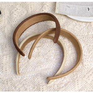 Detailed texture of braided cotton linen headbands in brown, khaki and beige colors
