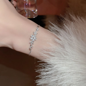 Detail of adjustable zircon flower bracelet showing the exquisite floral charm and sliding clasp