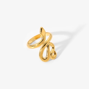 Macro detail of high quality vintage gold snake ring with sparkling diamond accents