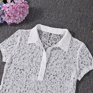 Detailed close-up of white floral lace polo shirt with classic collar and buttons