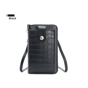 Close-up of black PU leather crossbody phone bag featuring a crocodile texture pocket