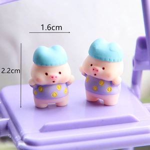 Detail showing 1.6cm width and 2.2cm height of cute mini resin pig figurine