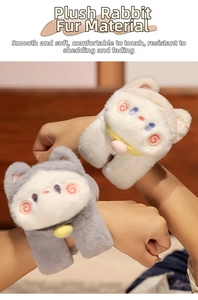 Close-up of cute plush cat slap bracelets in white and grey faux fur worn on wrists