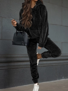 Detail of premium black velvet leisure set featuring long sleeve hoodie and jogger pants