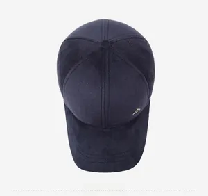 Top view of men's navy blue winter baseball cap with herringbone texture and metal logo detail