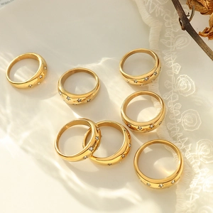 Stackable 18K gold plated rings set with star zircon patterns on lace background