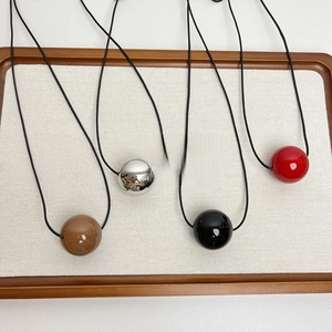 Minimalist long sweater necklace set with four large geometric sphere metal pendants
