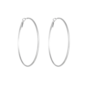 Detailed view of large silver hoop earrings with a polished metallic finish and sleek design