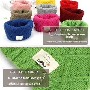 Detail of colorful cotton knit scarves with diamond pattern and mustache tag