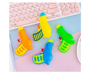 Close-up of four colorful mini plastic water guns in yellow, orange, blue, and green