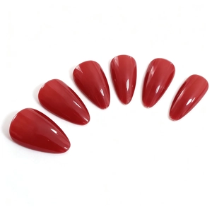 Glossy cherry red almond shaped press-on nails set on a clean white background