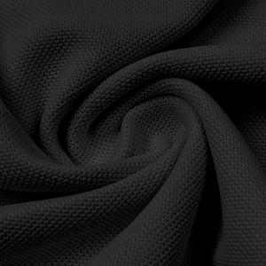 Macro shot of black pique knit fabric texture on men's breathable golf polo shirt
