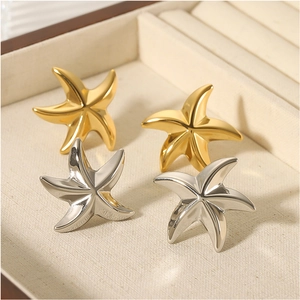 Minimalist 18K gold and silver plated starfish earrings in a premium jewelry box