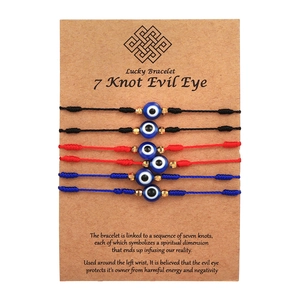 Set of 6 adjustable evil eye friendship bracelets in red, blue, and black nylon cord