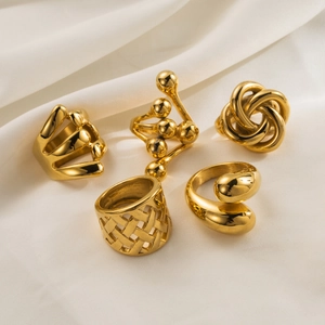 5-piece gold stainless steel ring set with chunky bead, weave, and minimalist designs