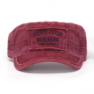 Detail of burgundy washed cotton flat top army cap with vintage embroidery and raw edges
