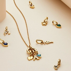 Gold-plated stainless steel necklace with multi-colored birthstone charms and letters