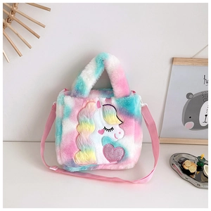 Detail of plush unicorn bag featuring rainbow faux fur and pink sequin heart embroidery
