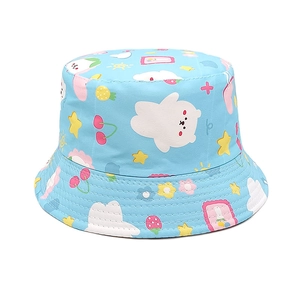 Close-up of baby sun hat featuring cute cartoon cloud, bear, and cherry patterns