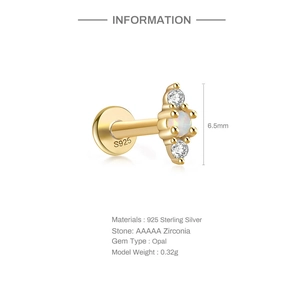 Macro detail of 925 sterling silver opal ear stud with 6.5mm zirconia screw flat back