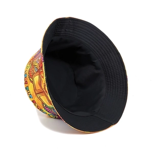 Reversible bucket hat with yellow Peace and Love graffiti print and black lining