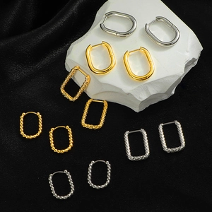 Minimalist geometric huggie earrings in gold and silver finish with hammered textures