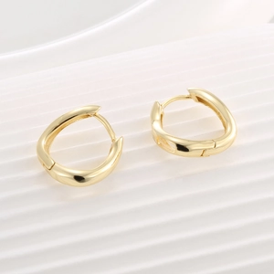 Polished 14K gold-plated asymmetrical cutout hoop earrings for women in a teardrop shape