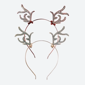 Detail of metal reindeer headbands with red berries and glittering antlers for Christmas
