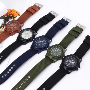 Multiple quartz sport watches with nylon straps in brown, blue, green, and black colors